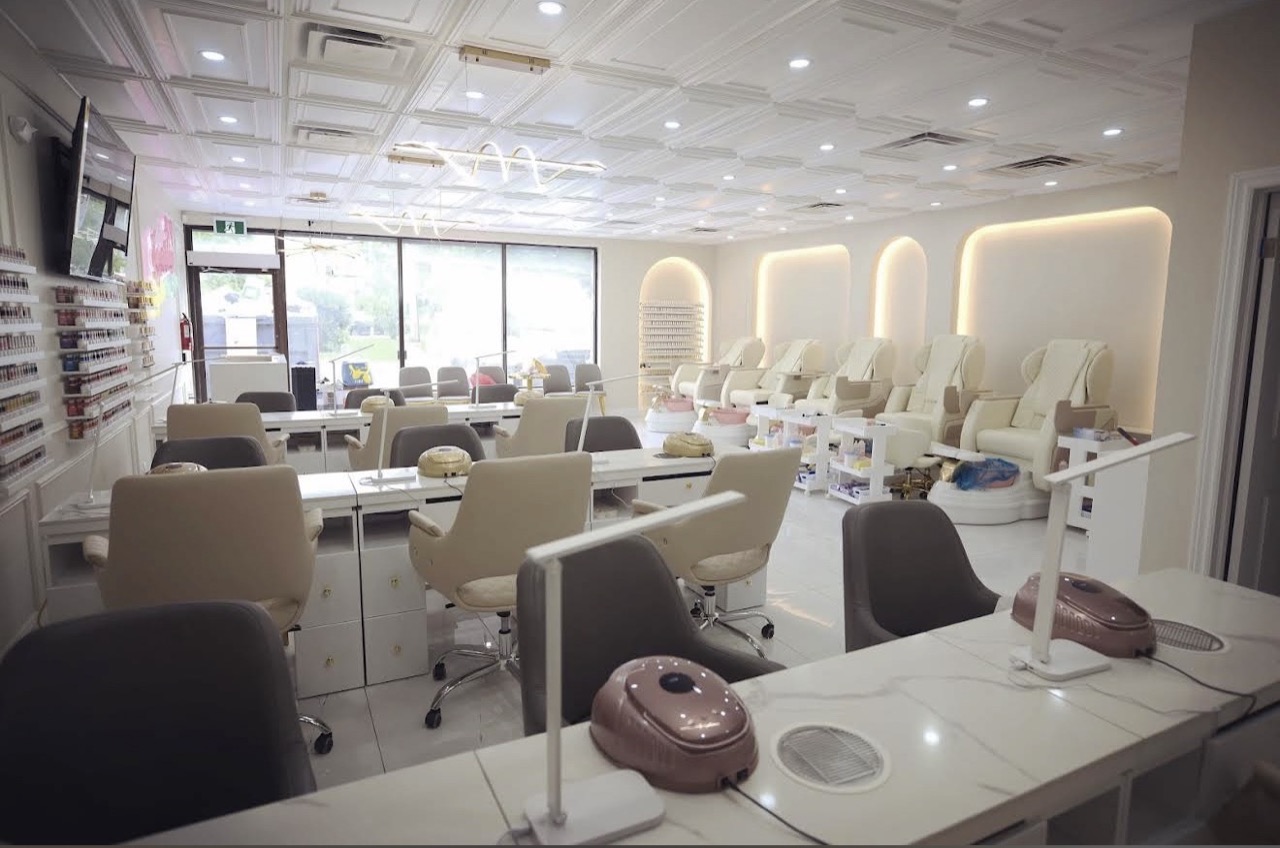 Manicure tables and pedicure chairs inside sparkle organic nails & spa.