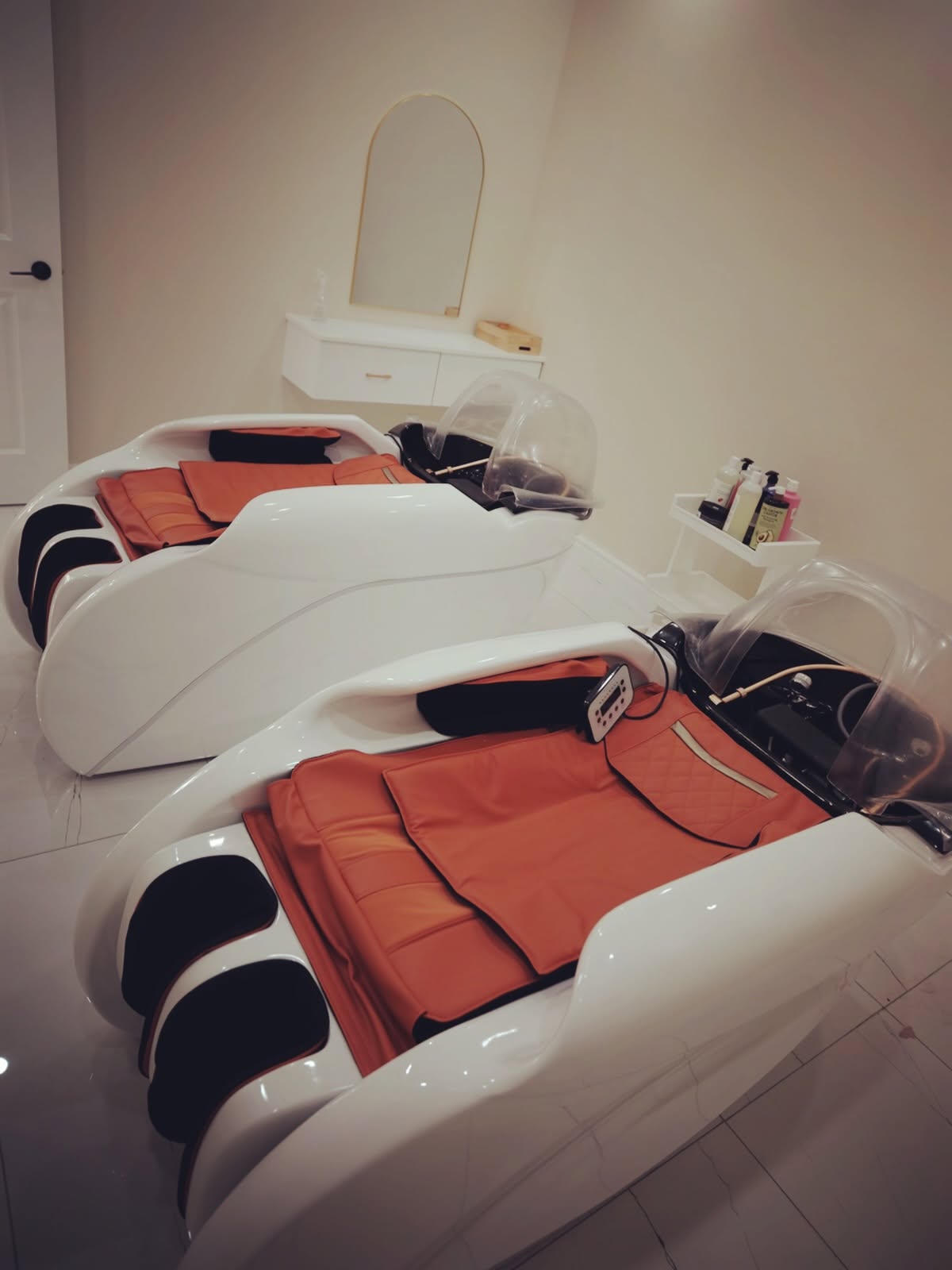 Two vietnamese head spa beds in the treatment room at sparkle organic nails & spa in london, ontario